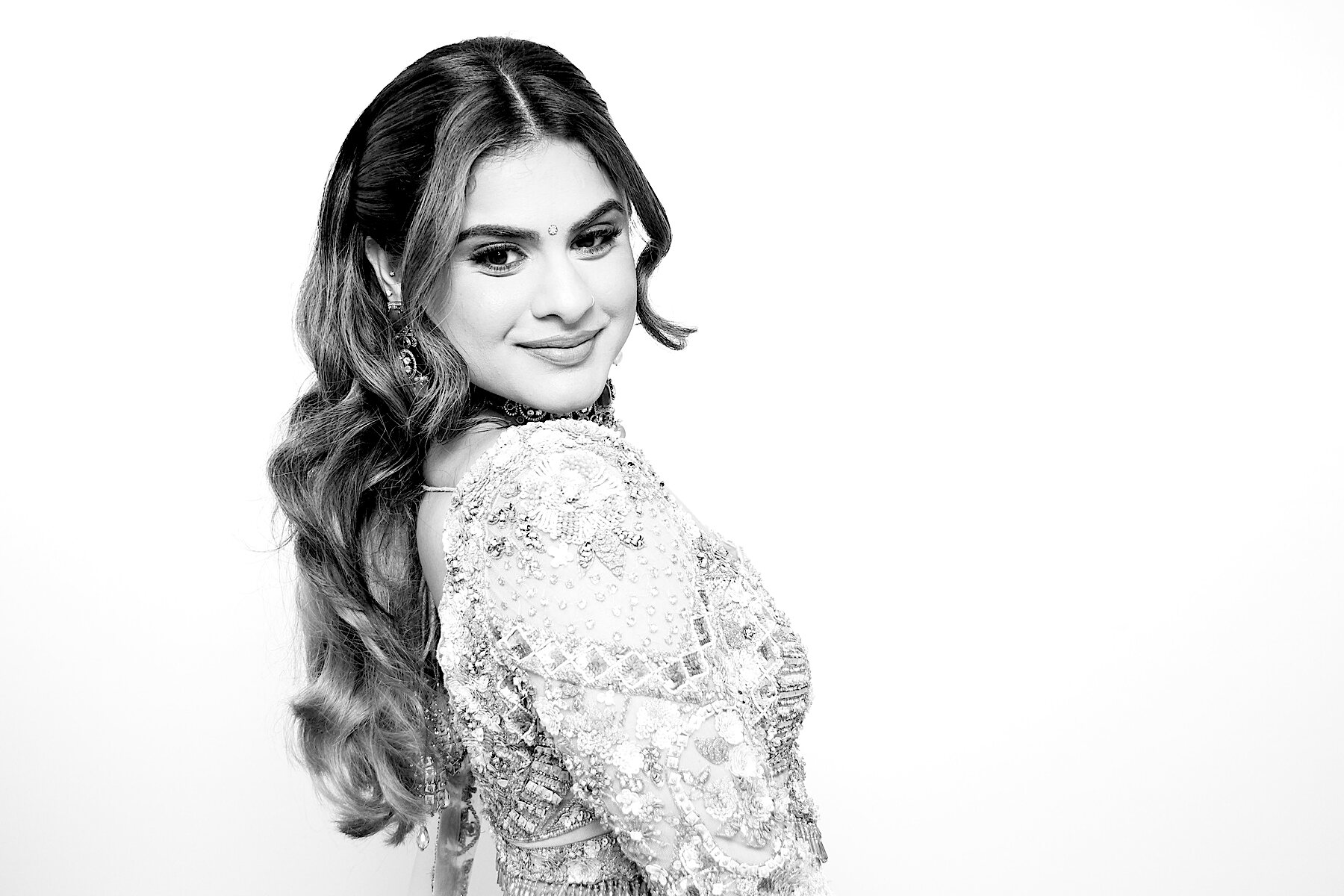 Bride looking over her shoulder in a black-and-white glam portrait
