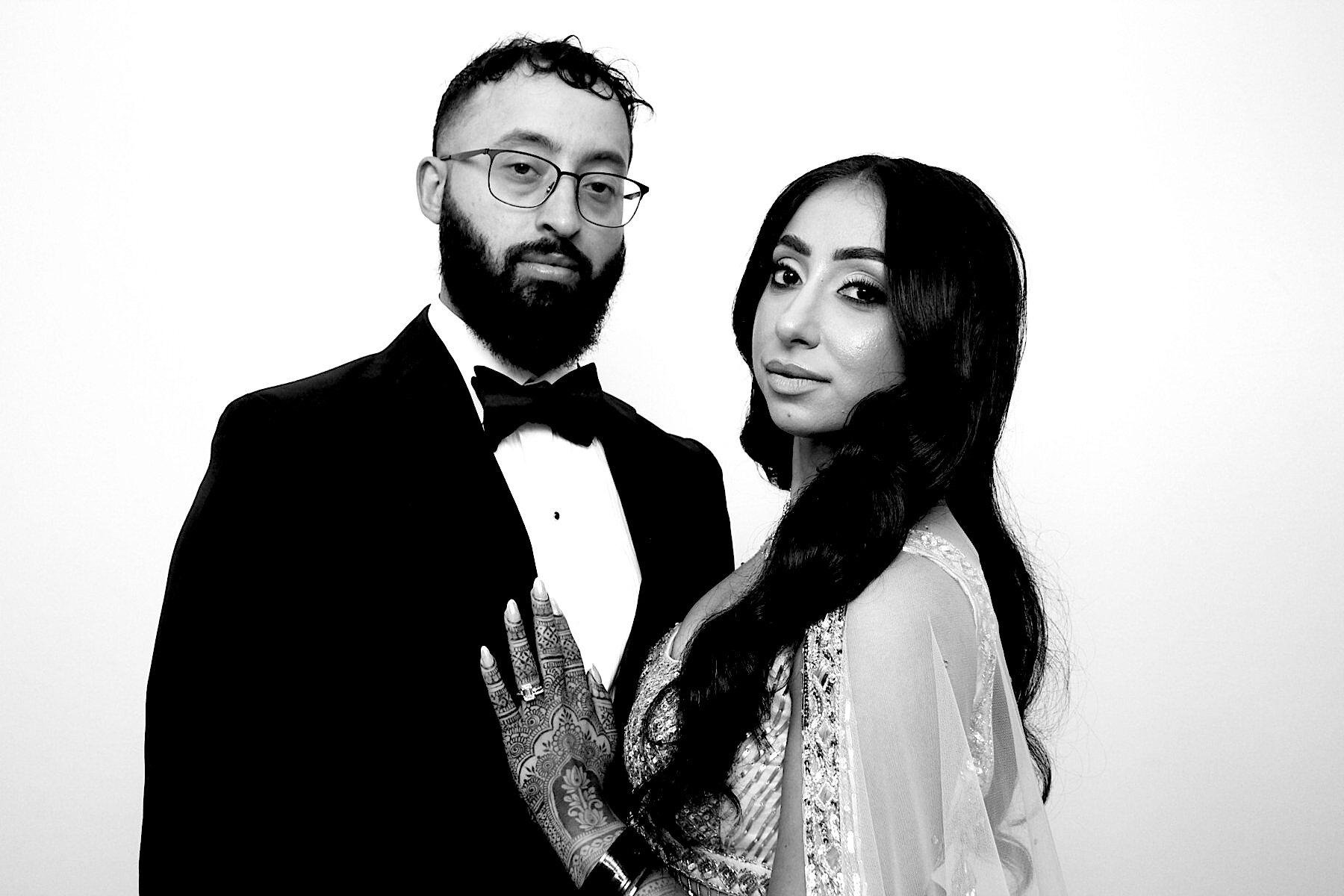 Couple dressed for a celebration, photographed in black and white