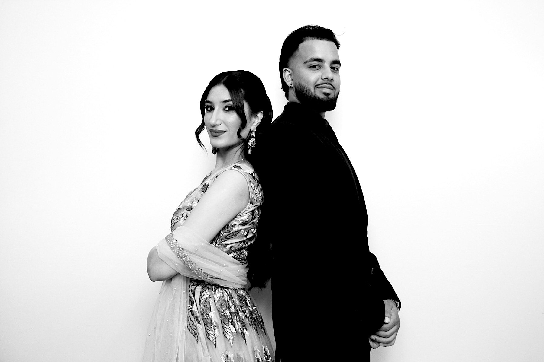 Guests posing back-to-back for a black-and-white portrait